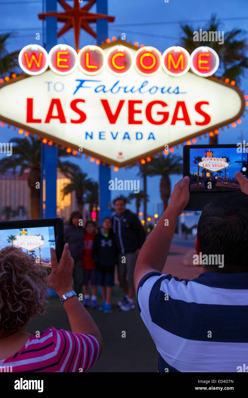 Tourists at Welcome to Las Vegas sign, Las Vegas, Nevada. Stock Photo