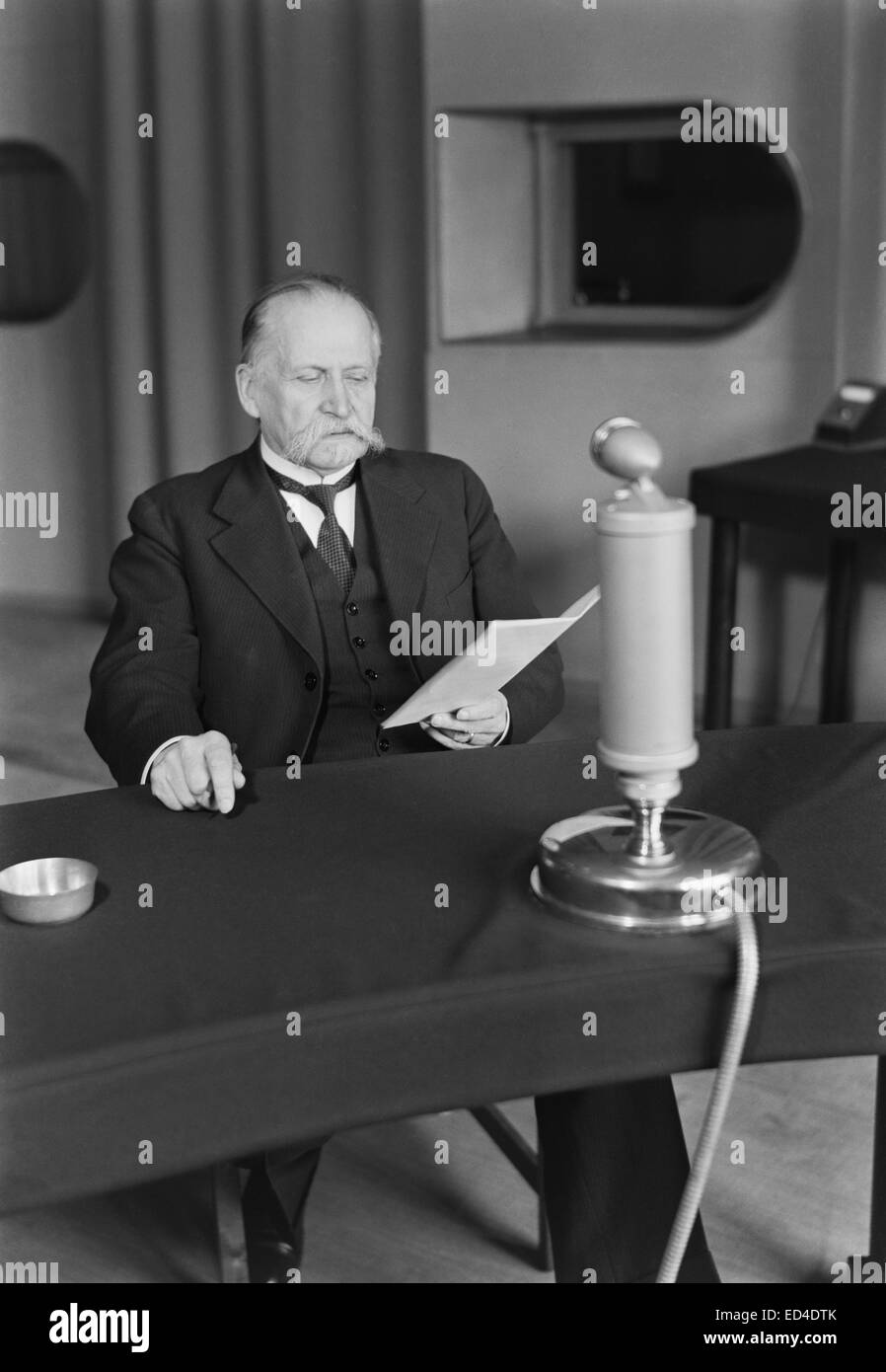 President Kyösti Kallio speaking on the radio, 1930s Stock Photo