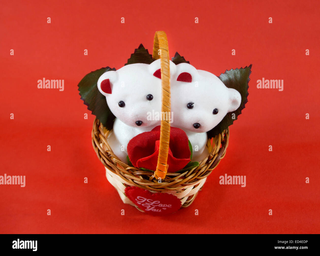 A cute white teddy bears with with rose in basket Stock Photo - Alamy