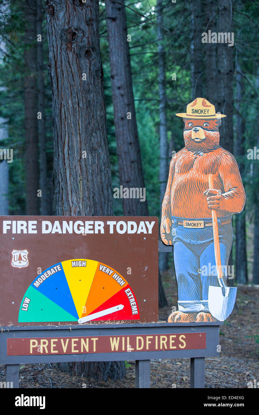 A sign showing extreme fir danger near the King Fire that burned 97,717 acres of the El Dorado National Forest in California, USA. Following an unprecedented four year long drought, wild fires are much more common. Most of California is in exceptional drought, the highest level of drought classification. 428,000 acres of agricultural land have been taken out of production due to lack of water, thousands of agricultural workers have lost their jobs and one third of all children in California go to bed hungry. Stock Photo