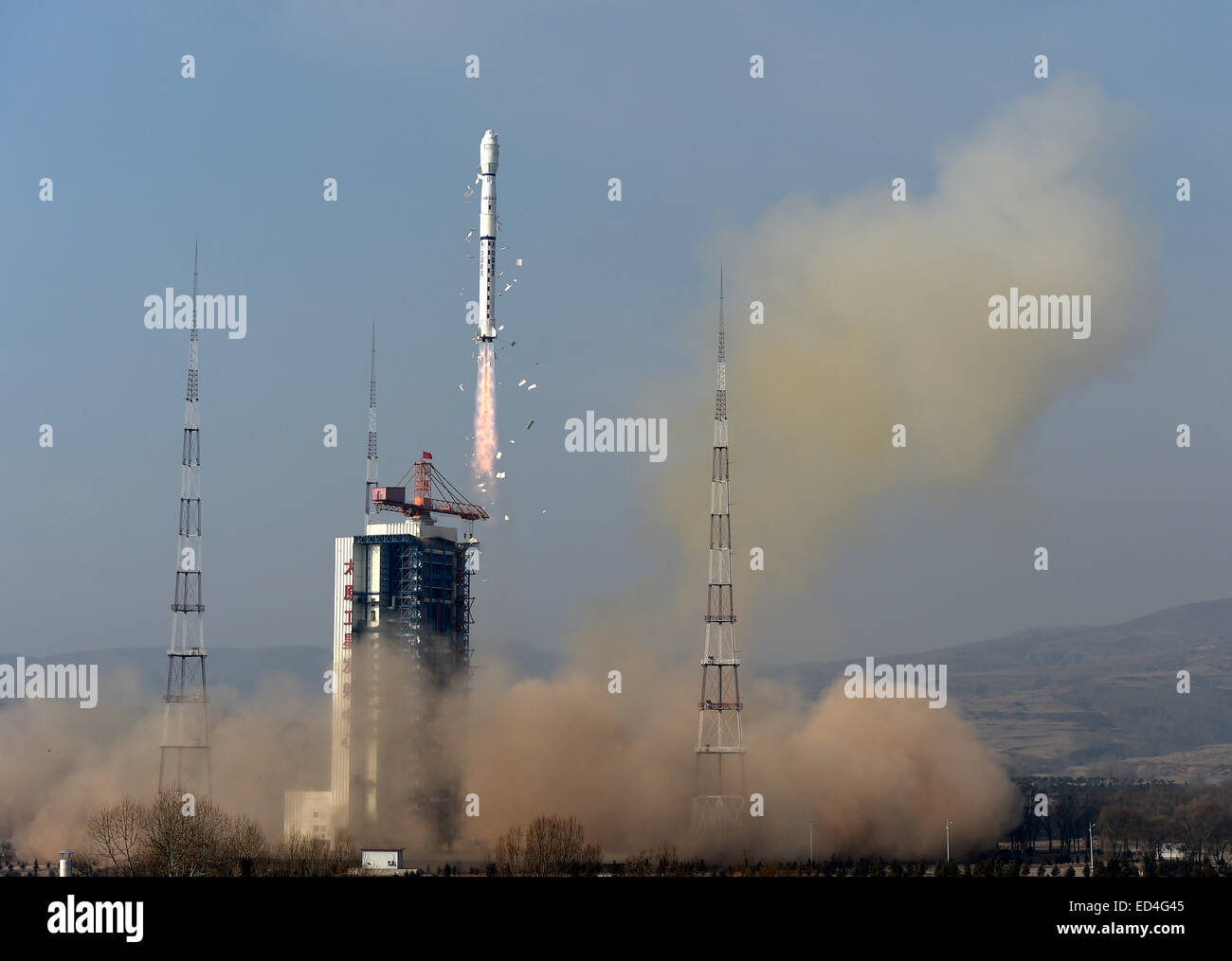 Taiyuan, China's Shanxi Province. 27th Dec, 2014. A Long March-4B rocket carrying the Yaogan-26 remote sensing satellite blasts off from the launch pad at the Taiyuan Satellite Launch Center in Taiyuan, capital of north China's Shanxi Province, Dec. 27, 2014. Yaogan satellites are mainly used for scientific experiments, natural resource surveys, crop yield estimates and disaster relief. Credit:  Yan Yan/Xinhua/Alamy Live News Stock Photo