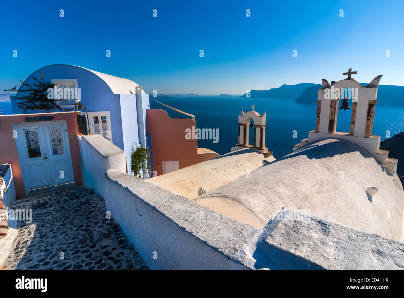 Santorini, Greece. Architecture detail in Oia with Aegean Sea in background, Greek Islands landmark of Mediterranean Sea. Stock Photo