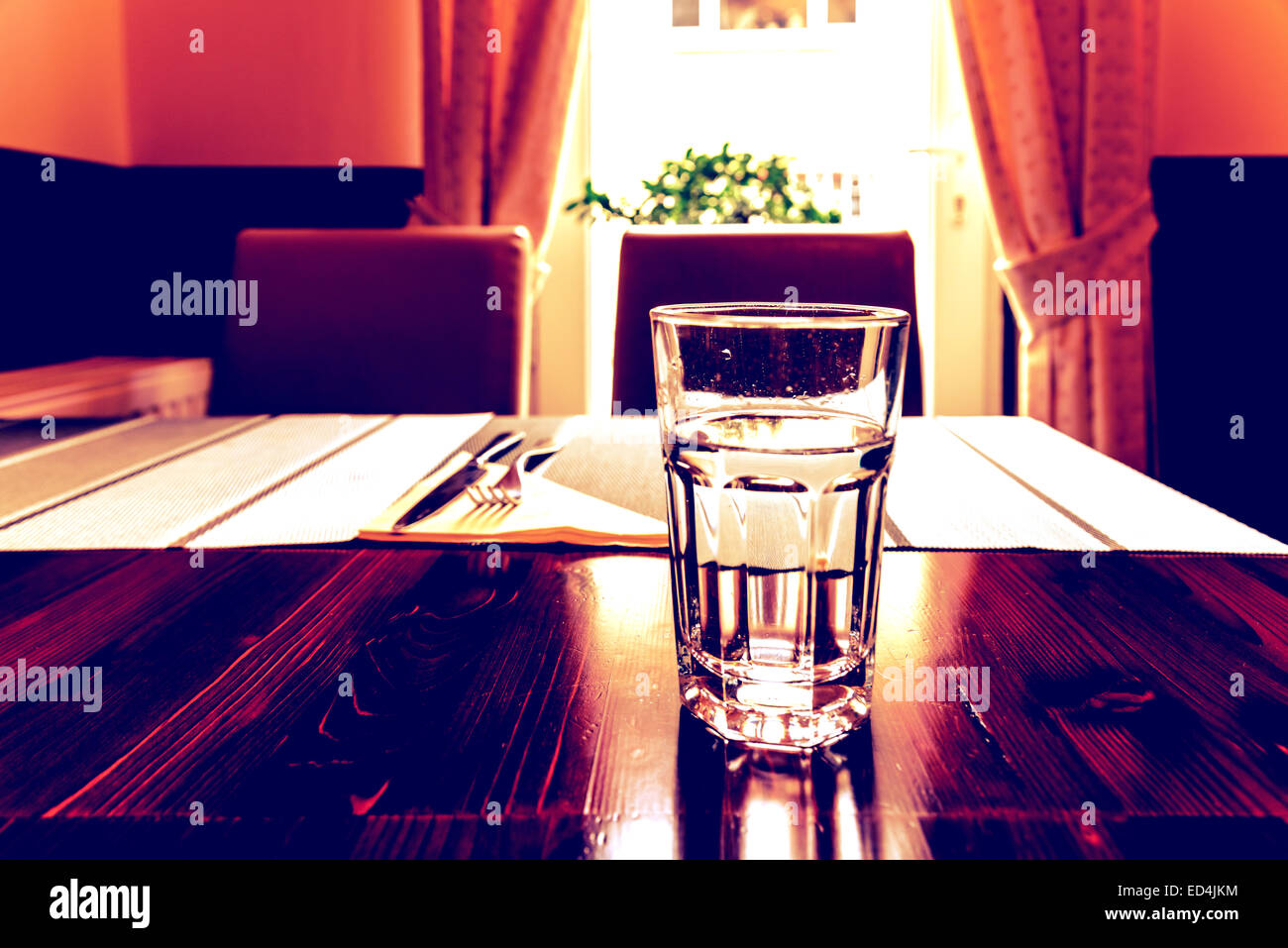 Glass Of Water On Vintage Restaurant Table Stock Photo