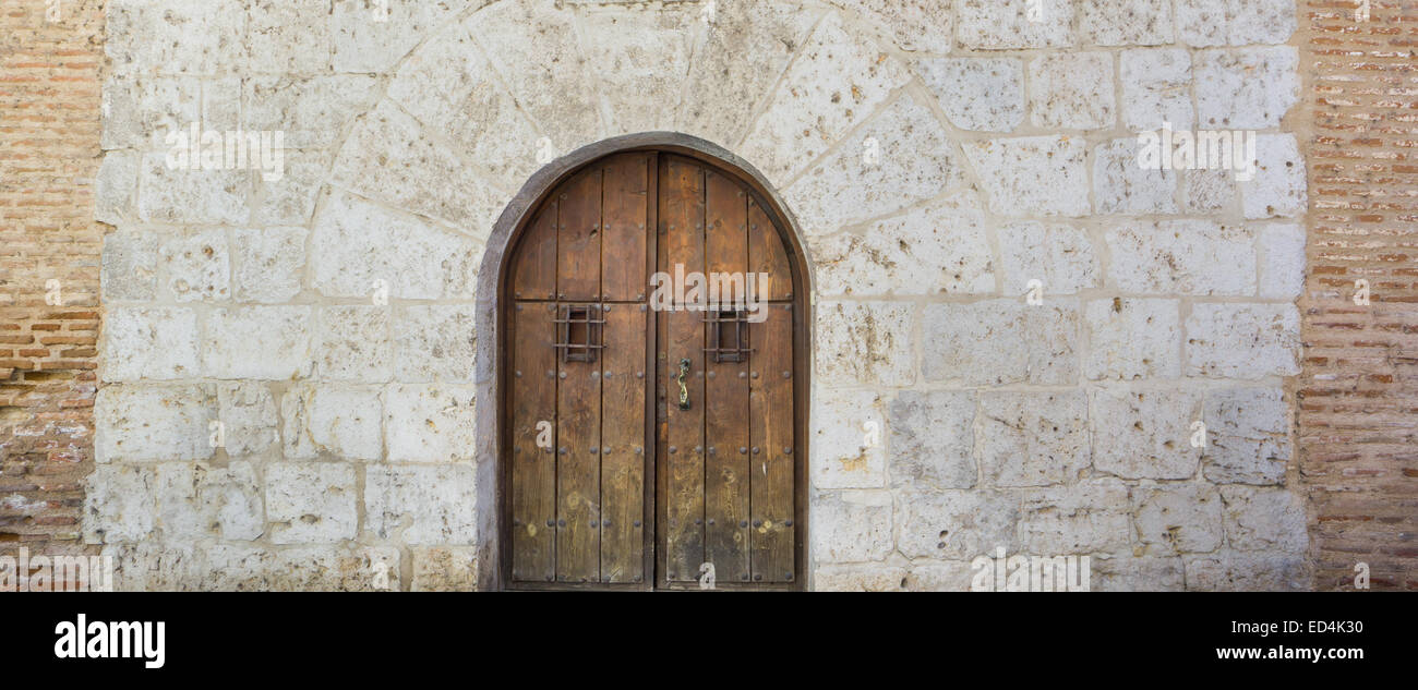 Old wooden door and stone wall Stock Photo - Alamy