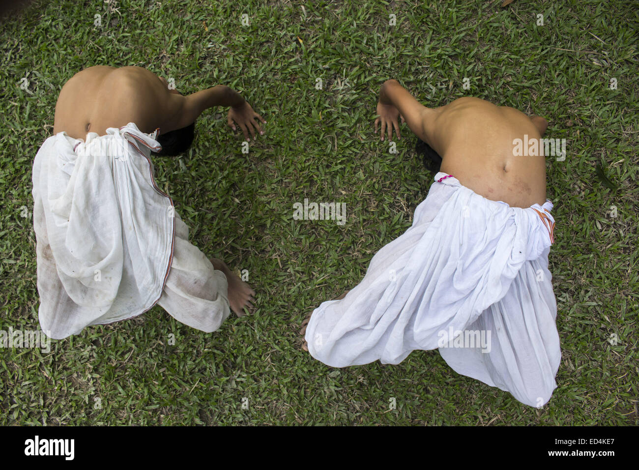 Majuli, Assam, India. 27th Dec, 2014. INDIA, MAJULI: Two junior bhakats (monks) practice Sankardeva's 'Mati Akhora' - the medieval Indian ground aerobics at Dakhinpat Satra, a Neo-Vaishnavite monastery at Majuli river island in Jorhat district in eastern Assam state, India on December 27, 2014. Satras (monasteries) follow the practice of bringing children at the tender age of 5-7 years. They are acculturated into the monastic order by a well drawn out system of daily routine and rituals under the supervision of senior monks taking up responsibility for individual child as the foster fathers. Stock Photo