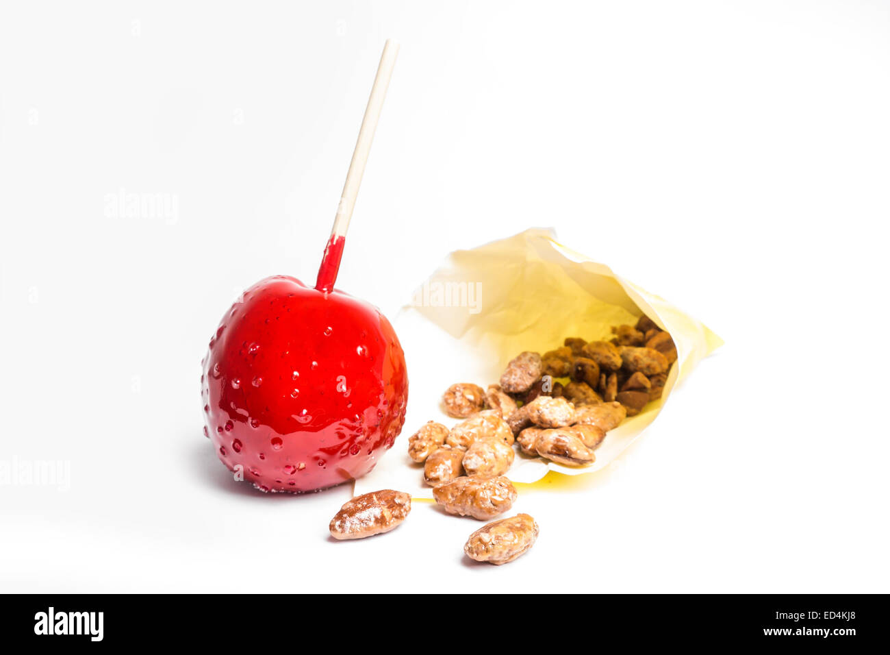 toffee apple, sugared almonds in packaging (isolated) Stock Photo