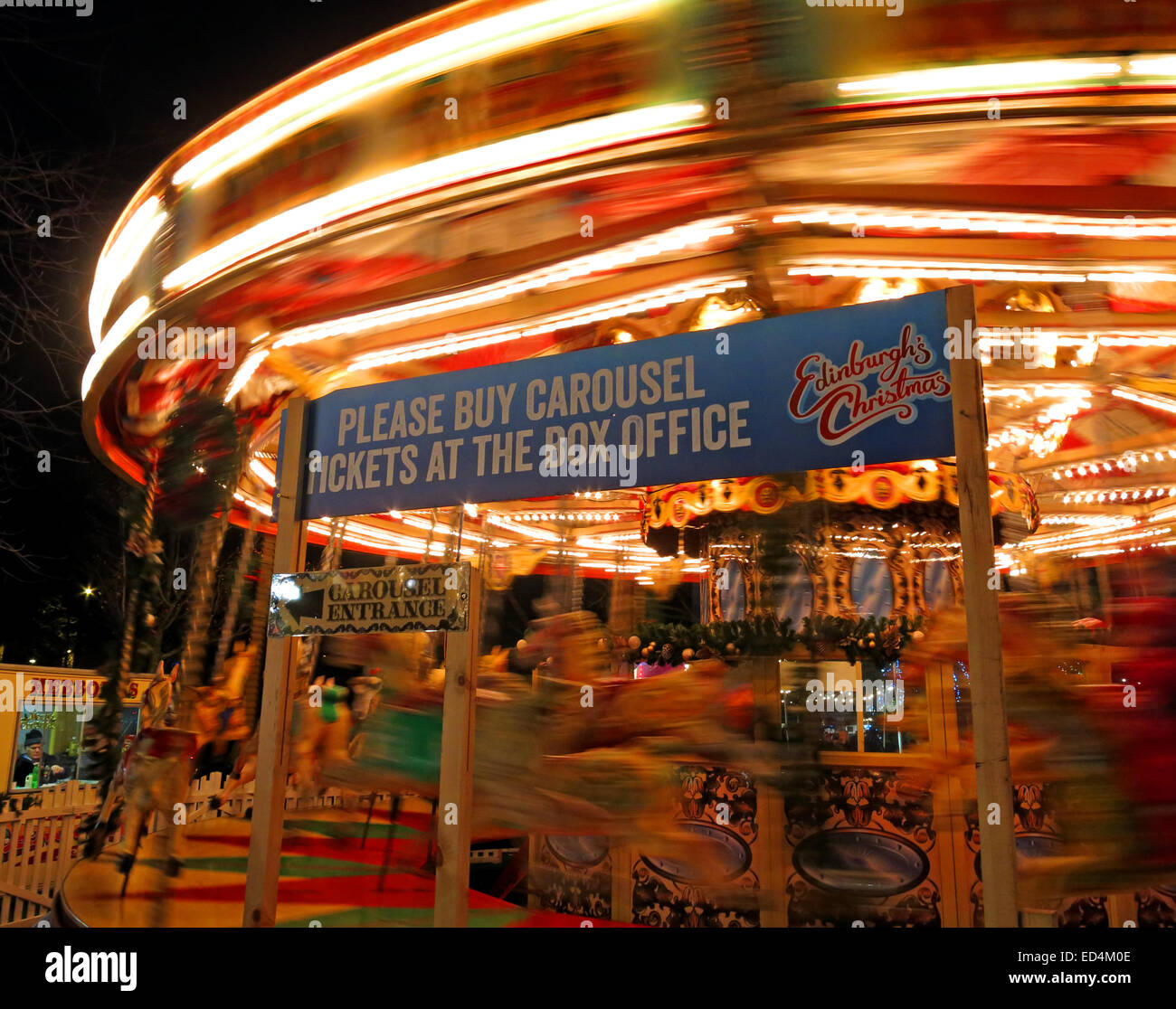 Traditional fairground attractions, Carousel, at Night at Edinburgh's Hogmanay, Scotland , UK Stock Photo