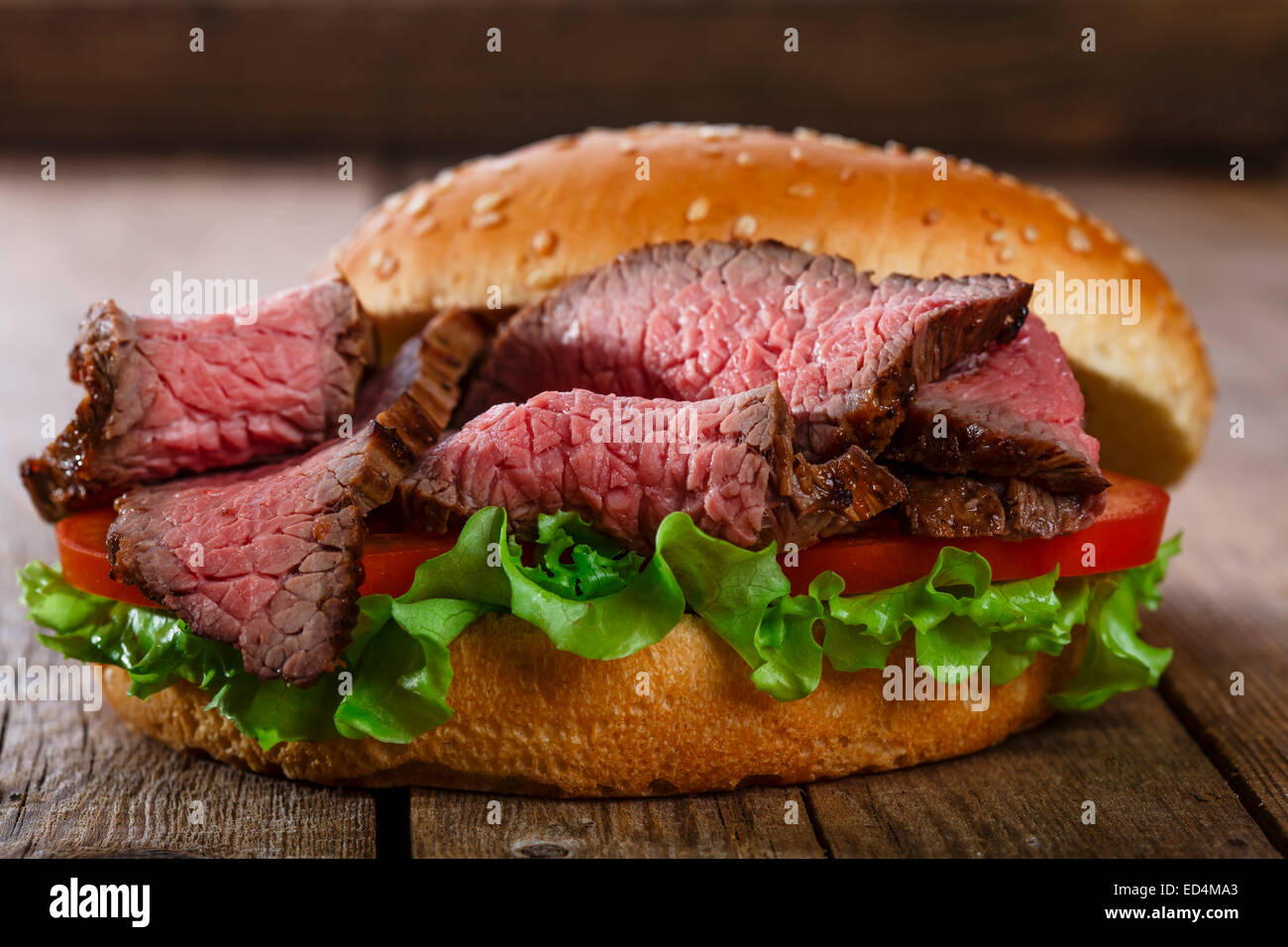 roast beef hamburger sandwich on a wooden surface Stock Photo