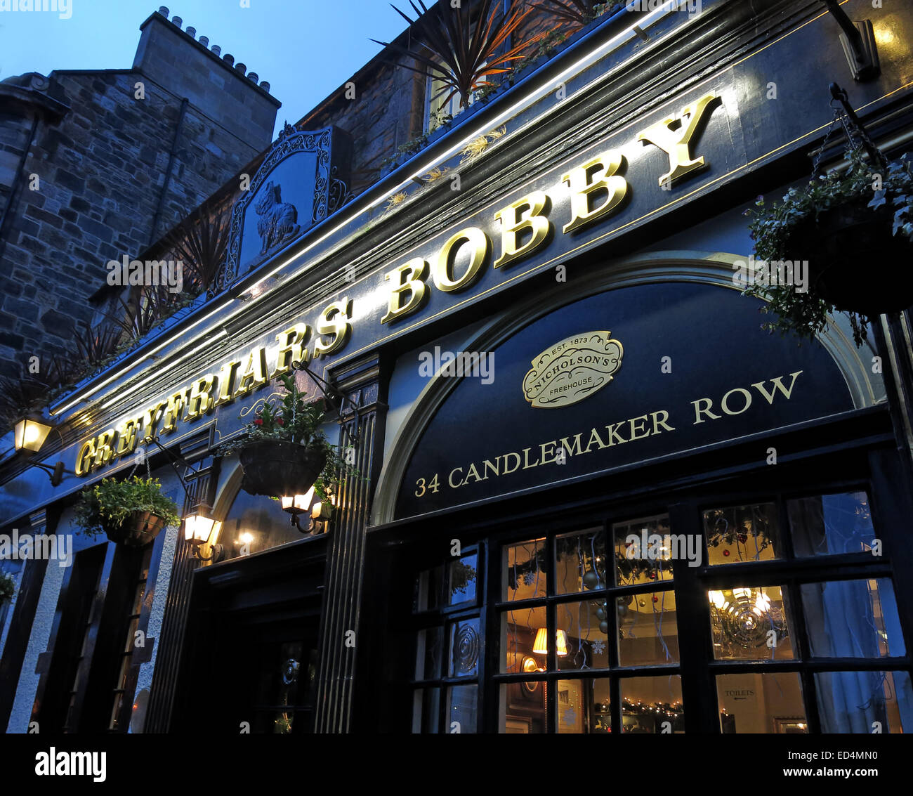 Greyfriars Bobby historic pub at dusk, Edinburgh Old Town, Dog outside, Lothians, Scotland, UK - Front Stock Photo