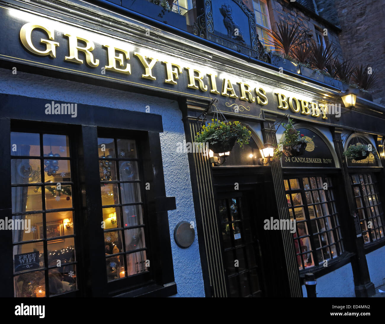 Greyfriars Bobby historic pub at dusk, Edinburgh Old Town, Dog outside, Lothians, Scotland, UK Stock Photo
