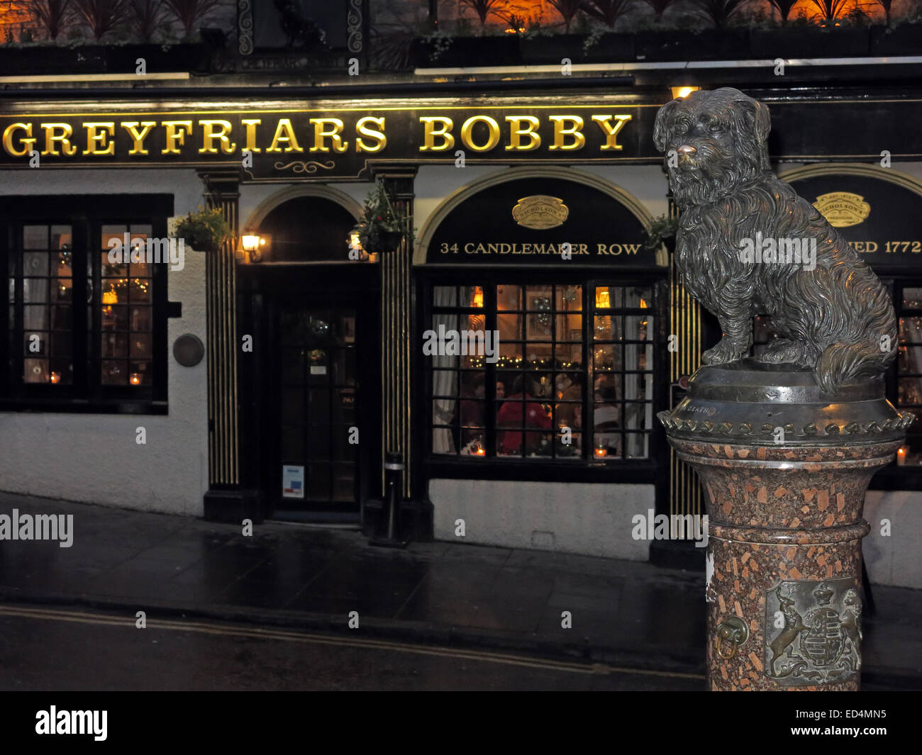 Greyfriars Bobby historic pub at dusk, Edinburgh Old Town, Dog outside, Lothians, Scotland, UK - With Bobby Stock Photo