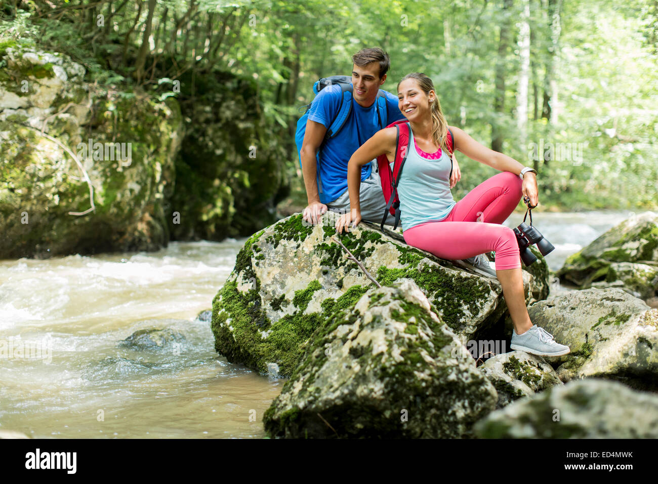 Young couple hiking in the forest Stock Photo