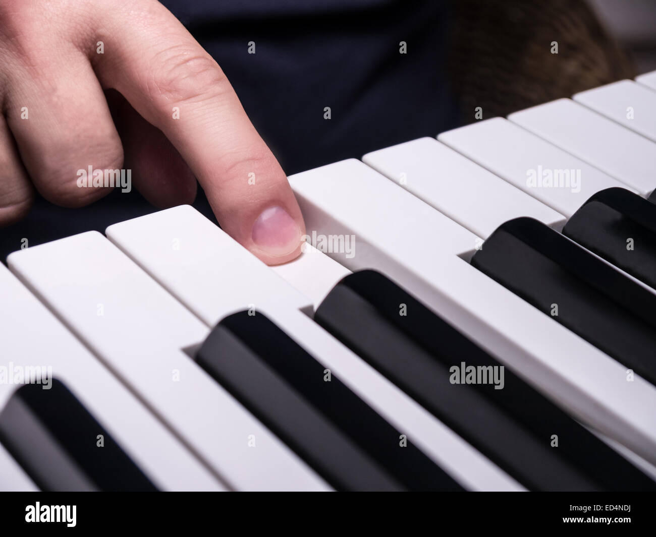 piano keys and hand on c Stock Photo