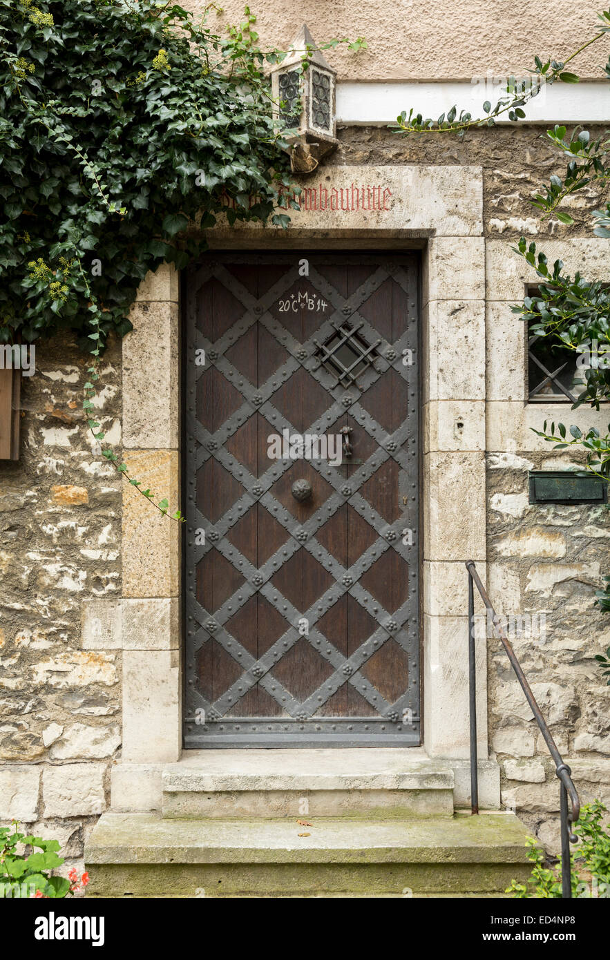Iron clad wooden entrance door in the medieval town of Regensburg ...