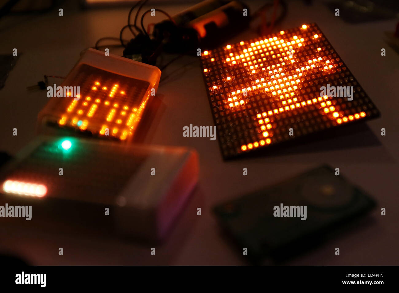 Hamburg, Germany, 27th Dec, 2014. Programmed displays lie on a table at the 31 Chaos Communication Congress in the Coongress Centre Hamburg, Germany, 27 December 2014. From 27 December 2014 to 30 December 2014 Europe's biggest hacker-scene meeting with the motto 'A new dawn' takes place in the hanseatic city. © dpa picture alliance/Alamy Live News Stock Photo
