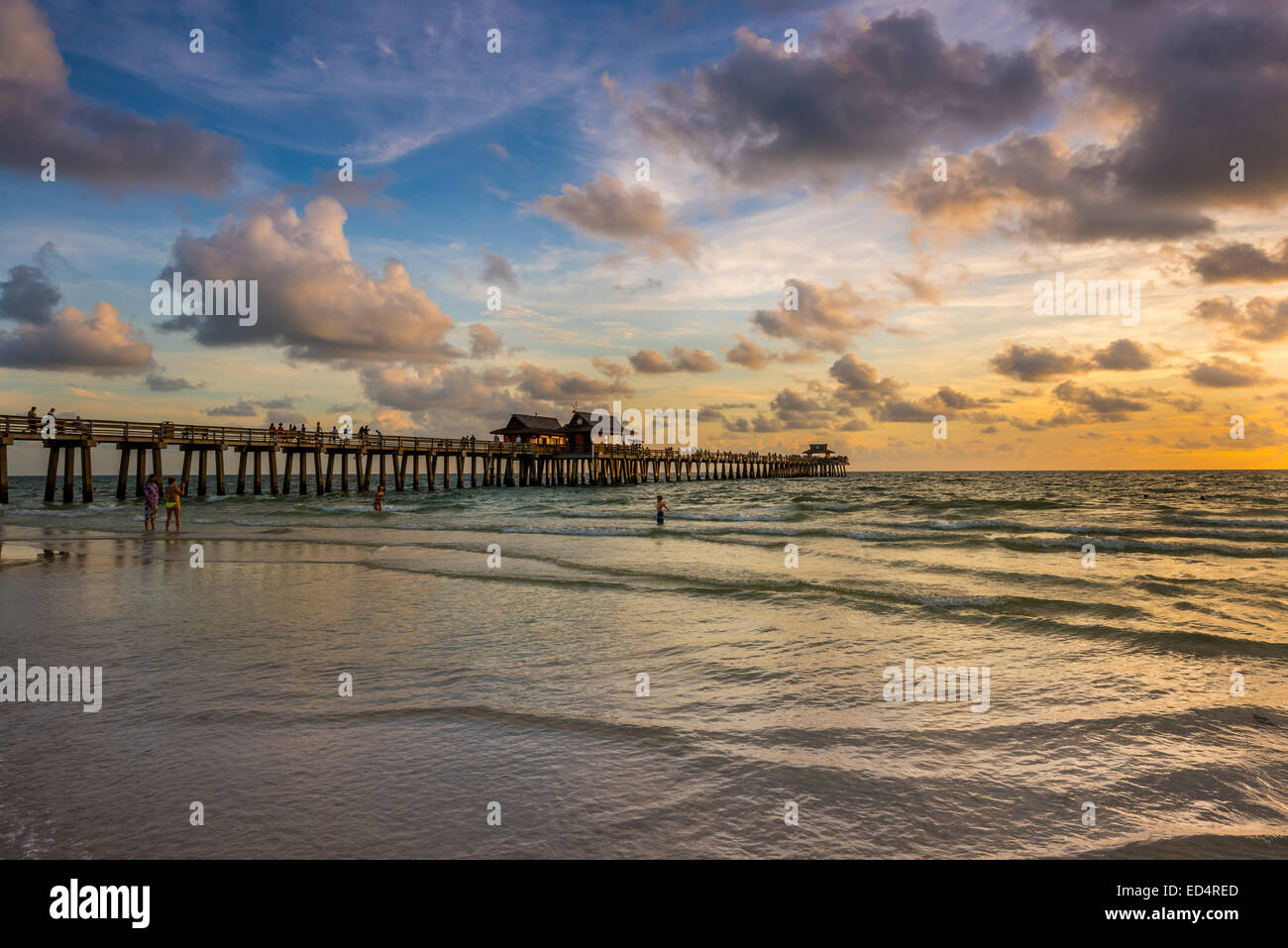 waves pier naples florida usa sunset ocean sea Stock Photo Alamy