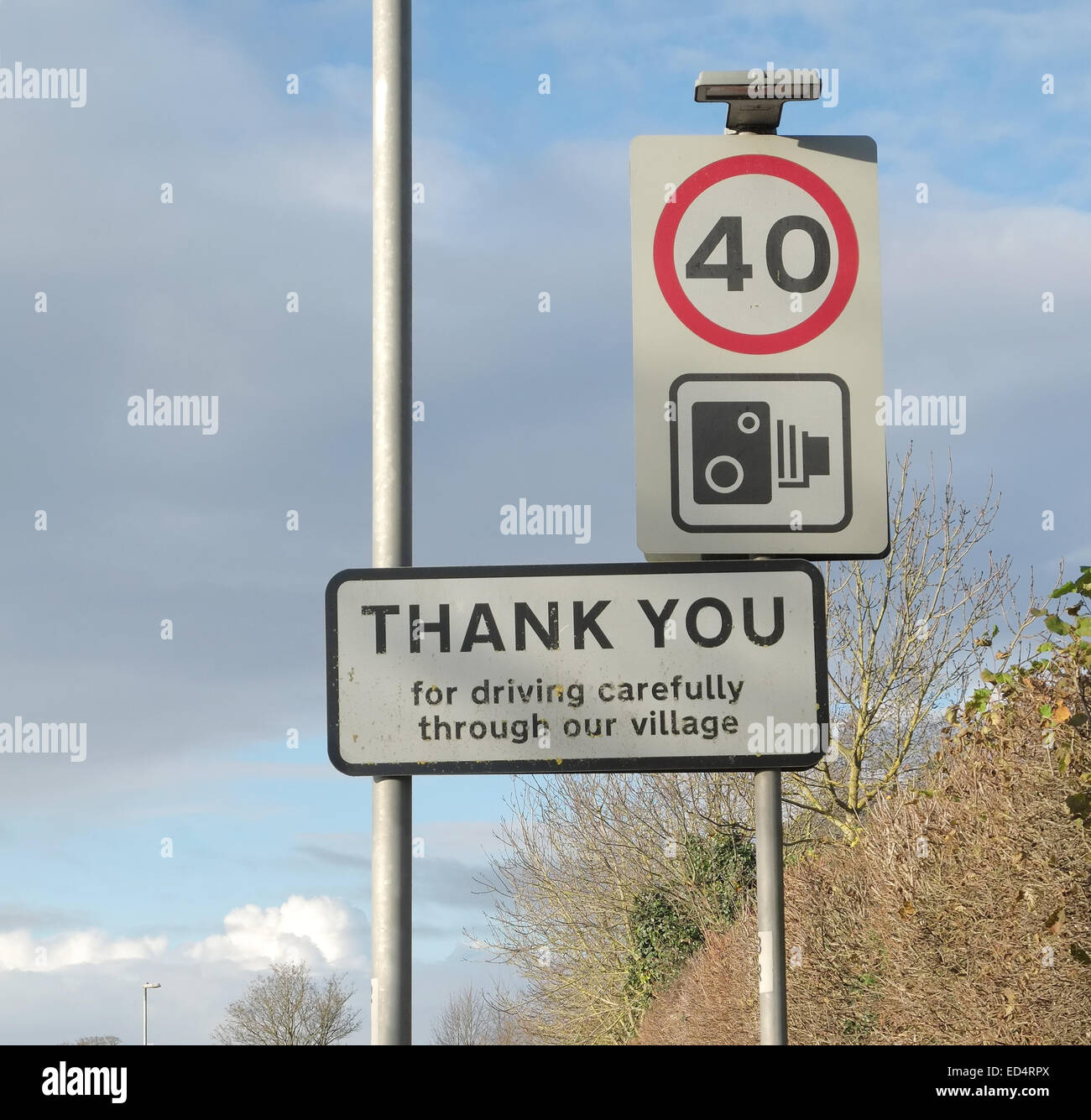 Thank you for driving carefully through out village sign on the exit from Cheddar, with a 40 speed limit sign 27th December 2014 Stock Photo