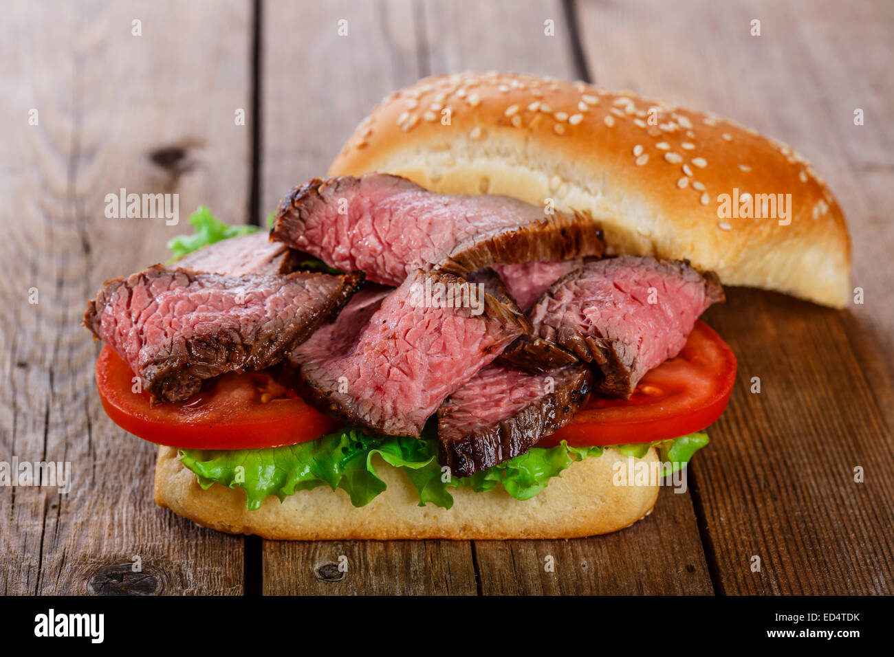 roast beef hamburger sandwich on a wooden surface Stock Photo Alamy