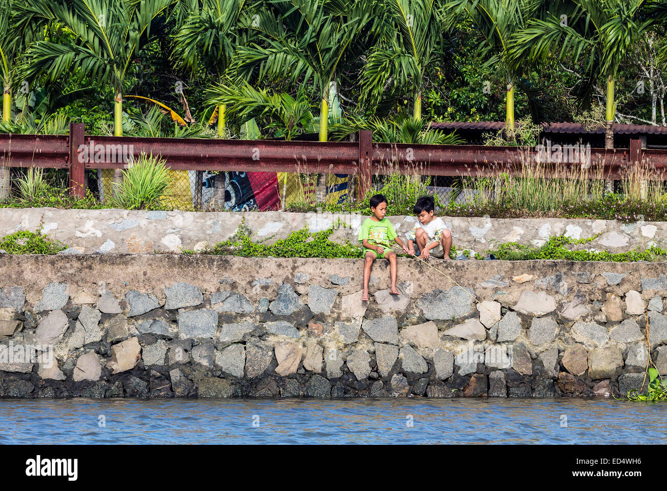 Two boys fishing in river hi-res stock photography and images - Alamy