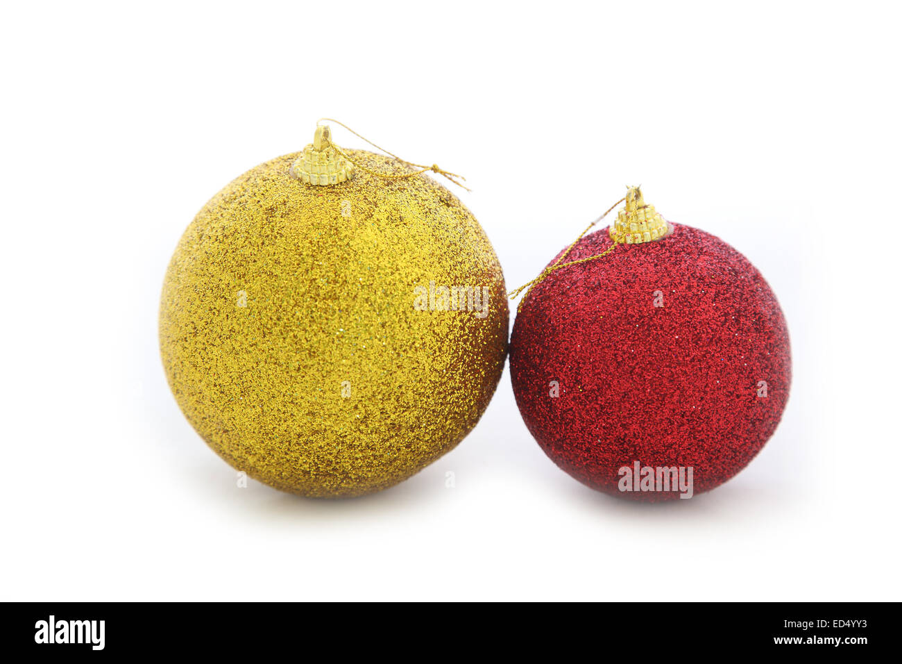 Christmas toy. Red and gold balls on a white background Stock Photo - Alamy