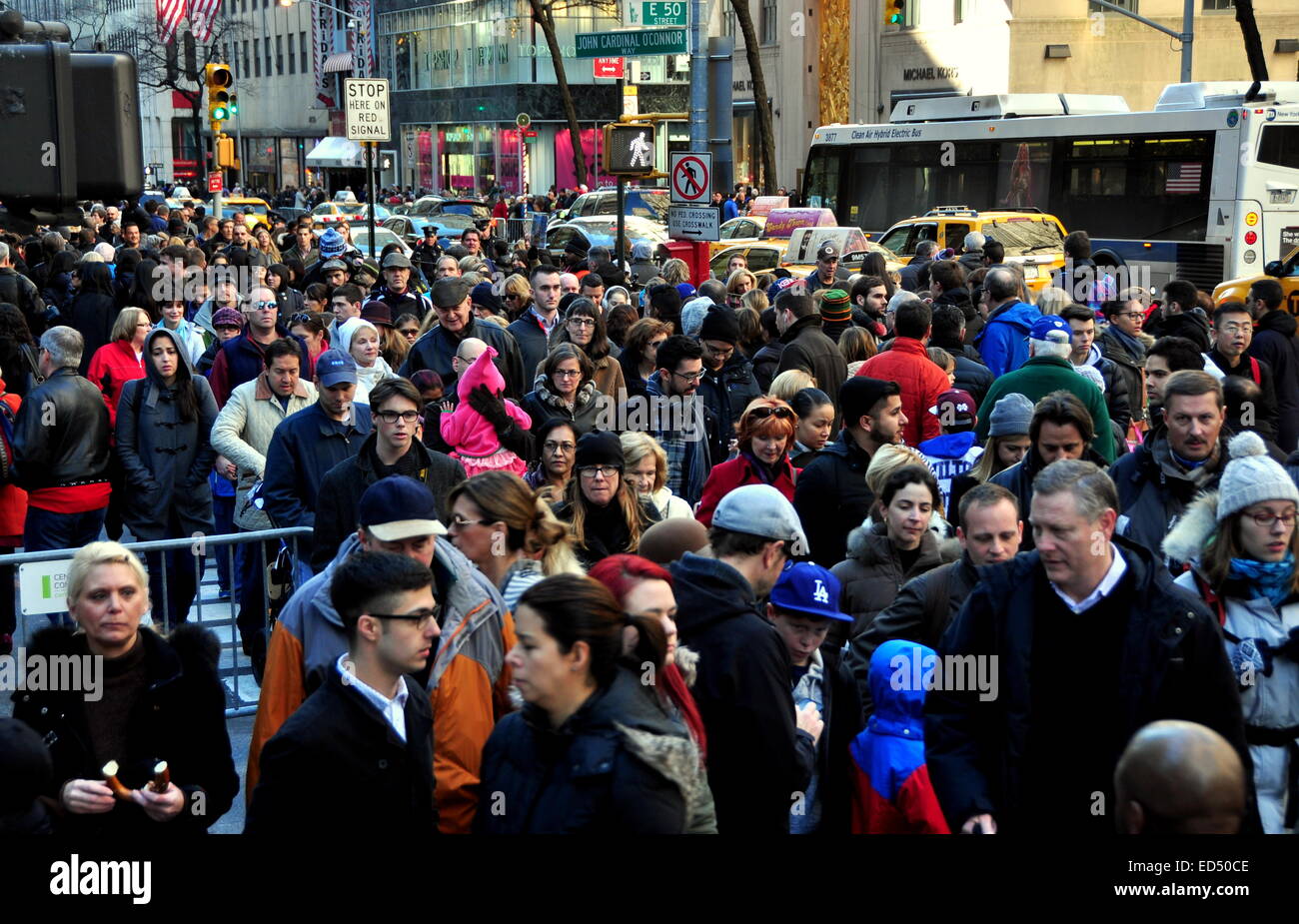 New York City - December 26, 2014:  Throngs of people walking along Fifth Avenue at 50th Street the day after Christmas Stock Photo