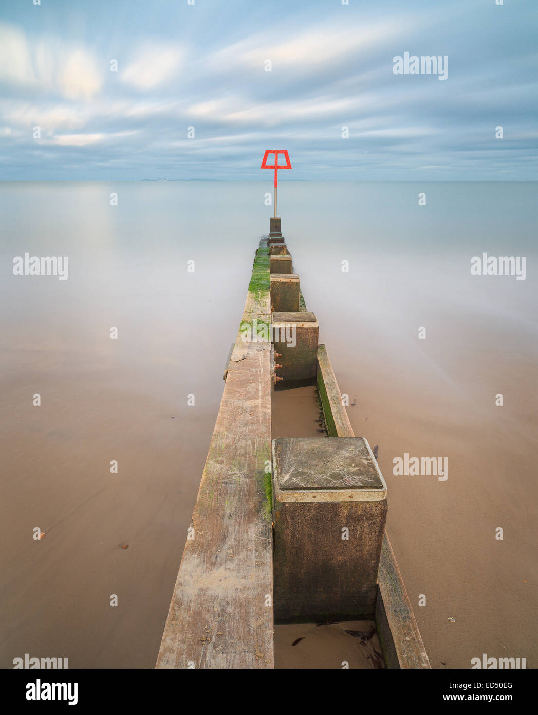 A breakwater, or groyne, on Swanage beach which helps to stop the sand from washing away. Stock Photo