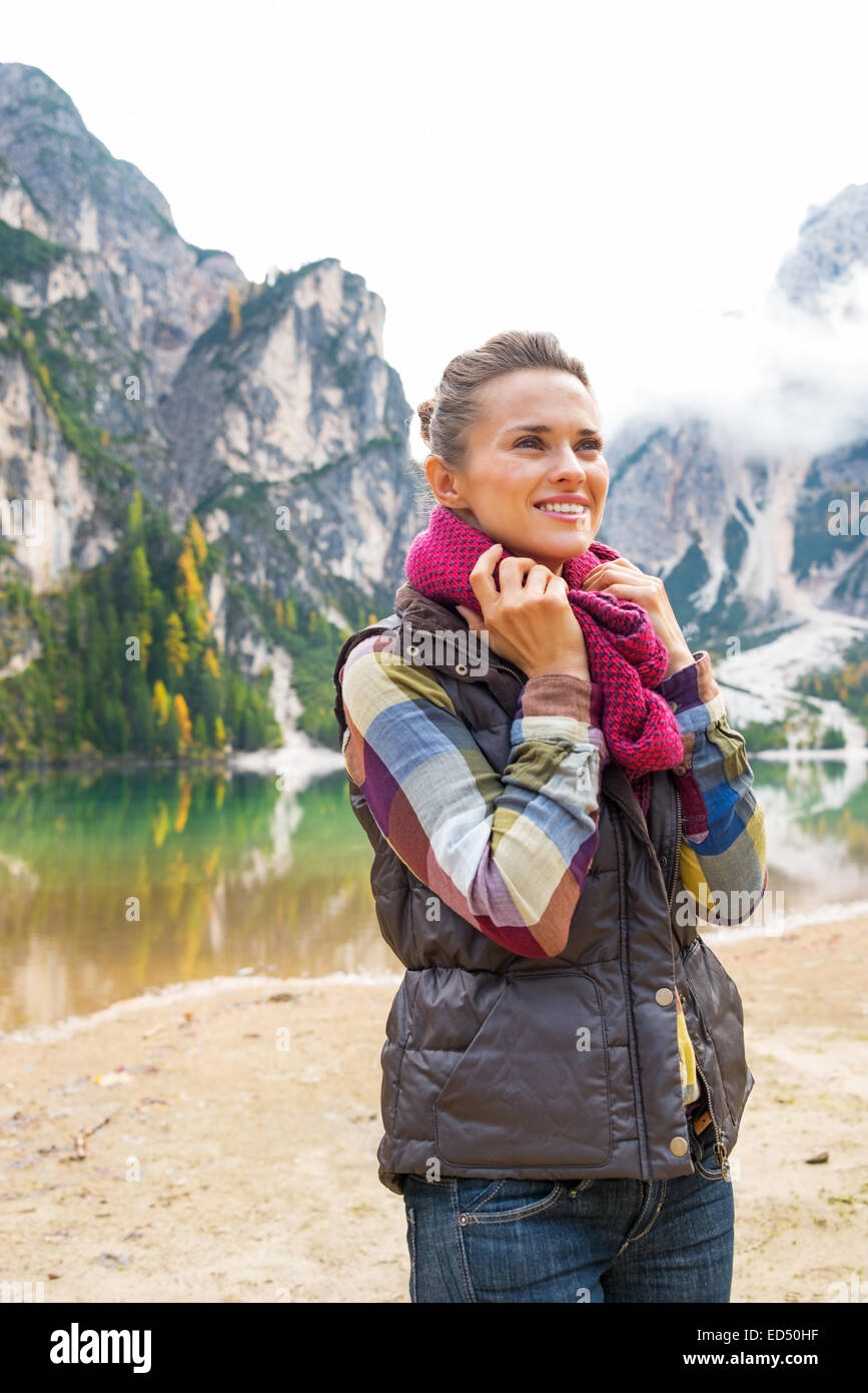 Portrait of happy young woman on lake braies in south tyrol, italy Stock Photo