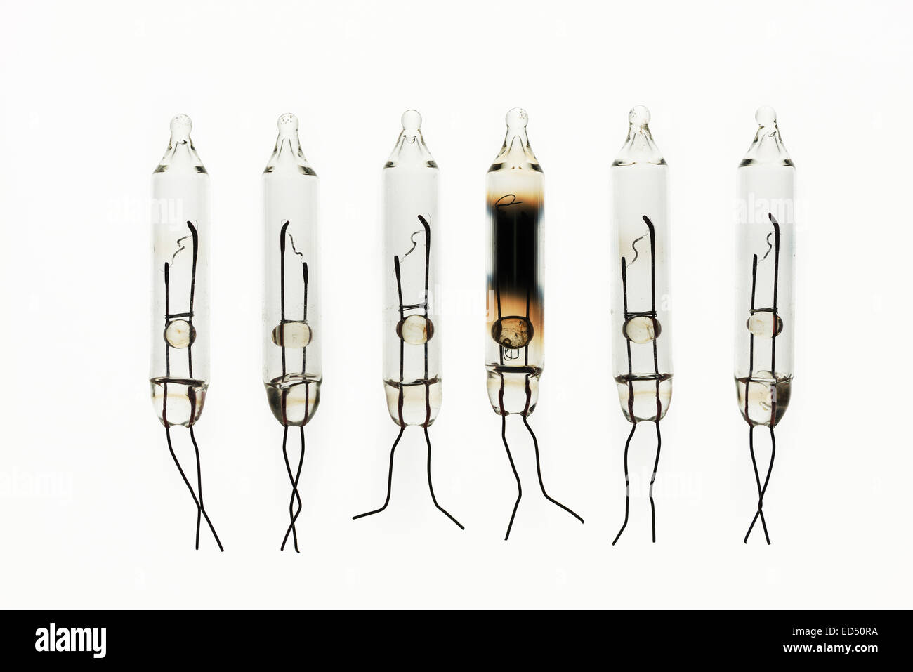 rows of tungsten filament light bulbs showing signs of metal ionization