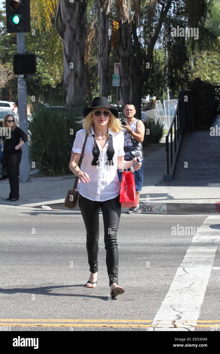 Anna Faris wearing a white blouse with an undone bow tie, leaves Wax salon carrying some goodies in a bag  Featuring: Anna Faris Where: Los Angeles, United States When: 24 Jun 2014 Stock Photo