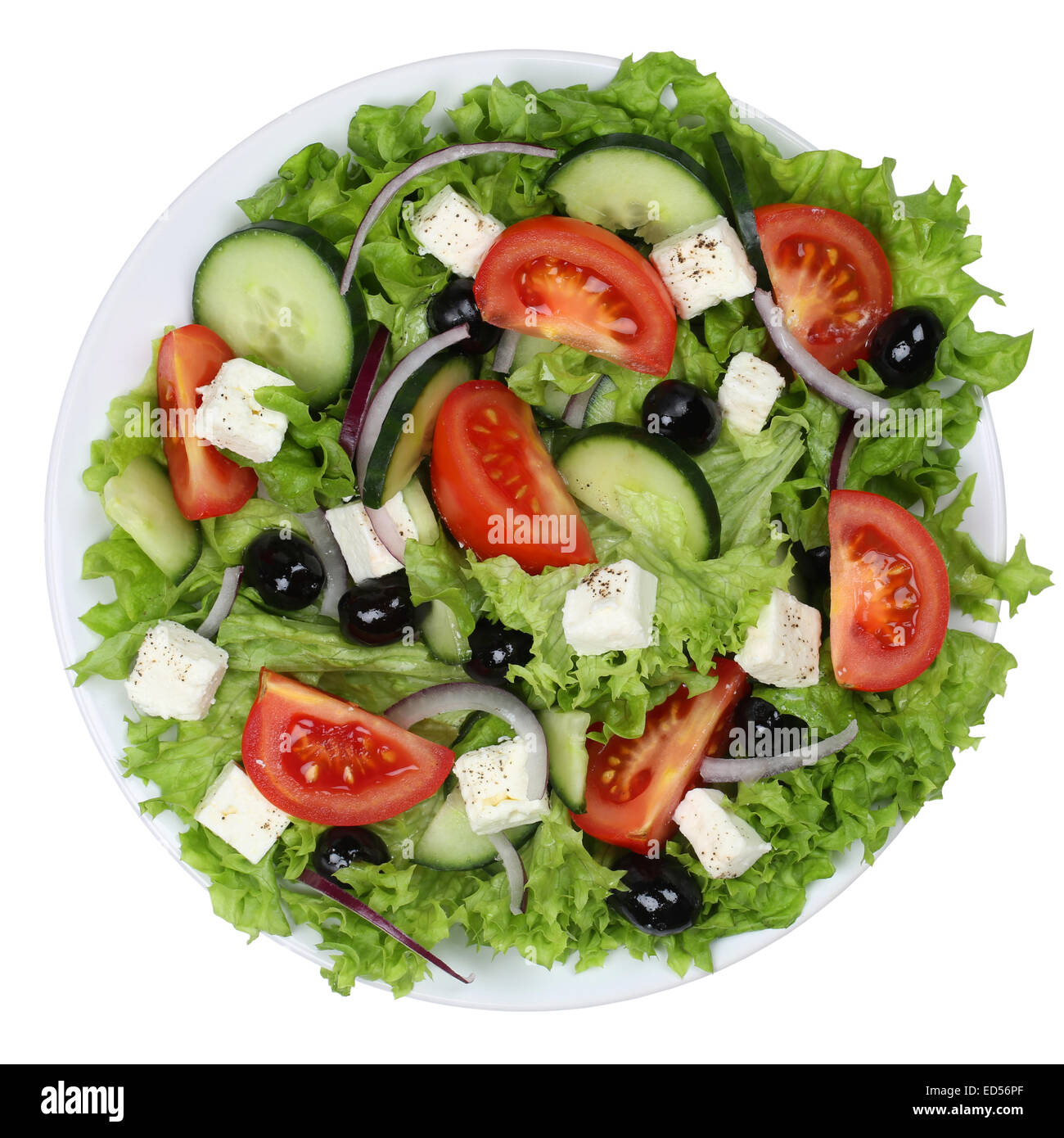 Greek salad with tomatoes, Feta cheese and olives in bowl from above isolated on a white background Stock Photo