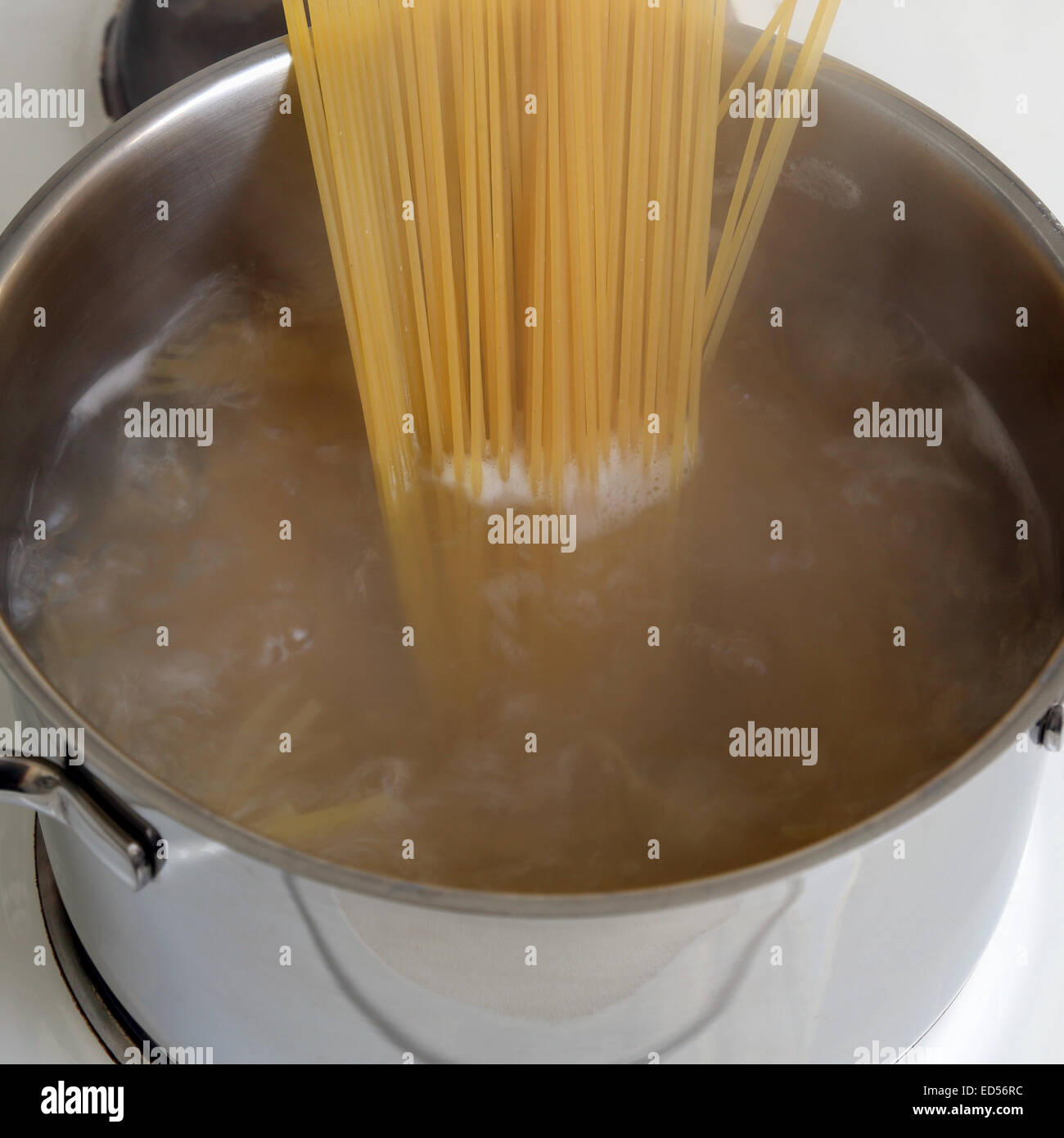 Preparing spaghetti pasta food meal cooking noodles in water in pot