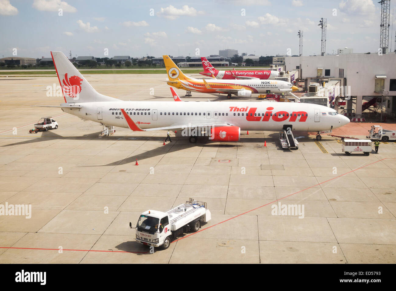 Thai Lion, AirAsia, airbus A320 and Nok air, aircrafts at gates in Bangkok airport Don Mueang. Thailand, Southeast Asia. Stock Photo