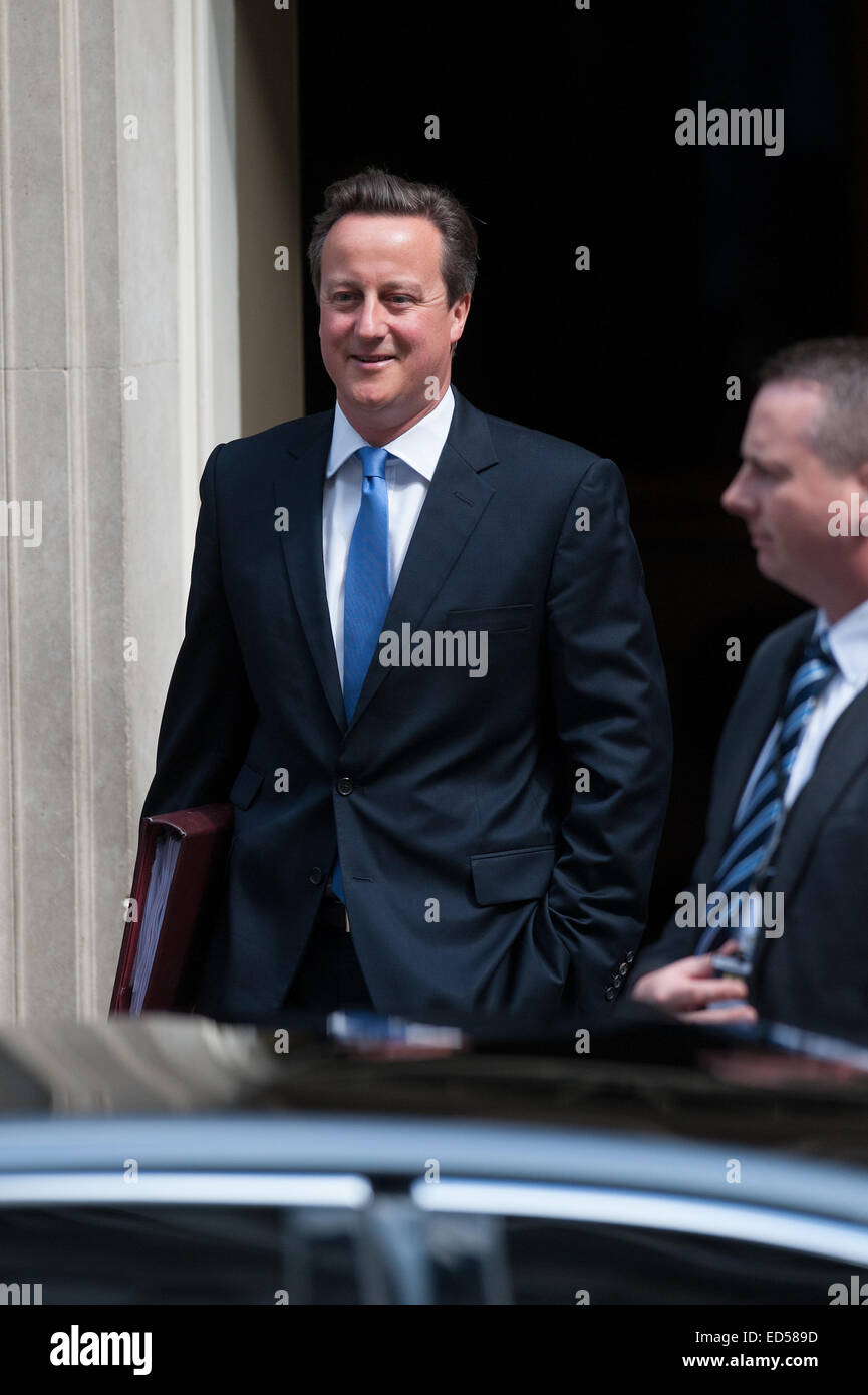 British Prime Minister David Cameron leaves 10 Downing Street on his way to Prime Minister's Questions at the House of Commons.  Featuring: David Cameron Where: London, United Kingdom When: 25 Jun 2014 Stock Photo