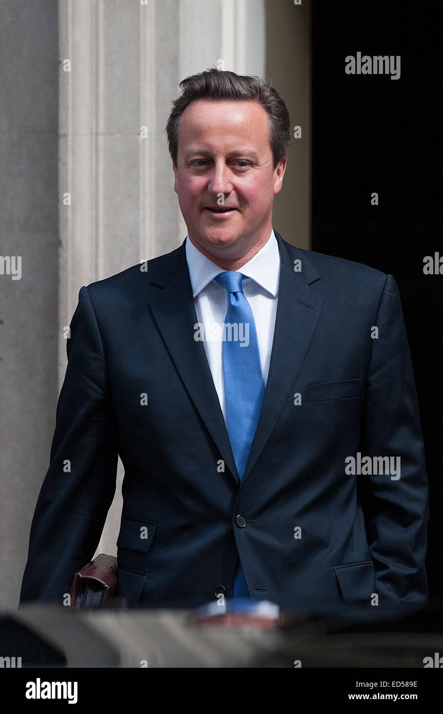 British Prime Minister David Cameron leaves 10 Downing Street on his way to Prime Minister's Questions at the House of Commons.  Featuring: David Cameron Where: London, United Kingdom When: 25 Jun 2014 Stock Photo