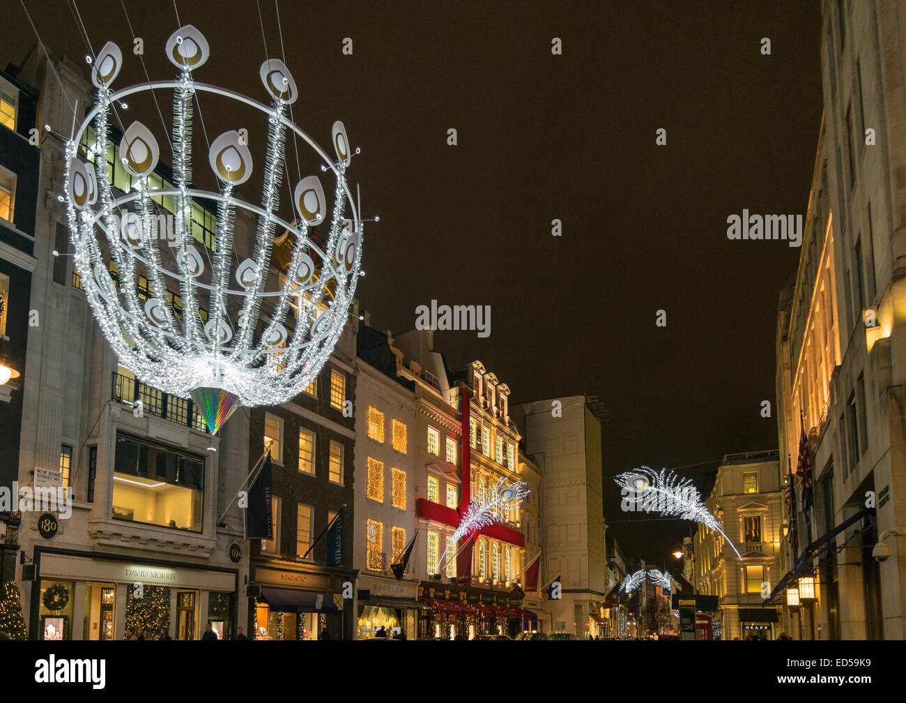 LONDON BOND STREET CHRISTMAS DECORATIONS OF A SILVER GLOBE AND PEACOCK