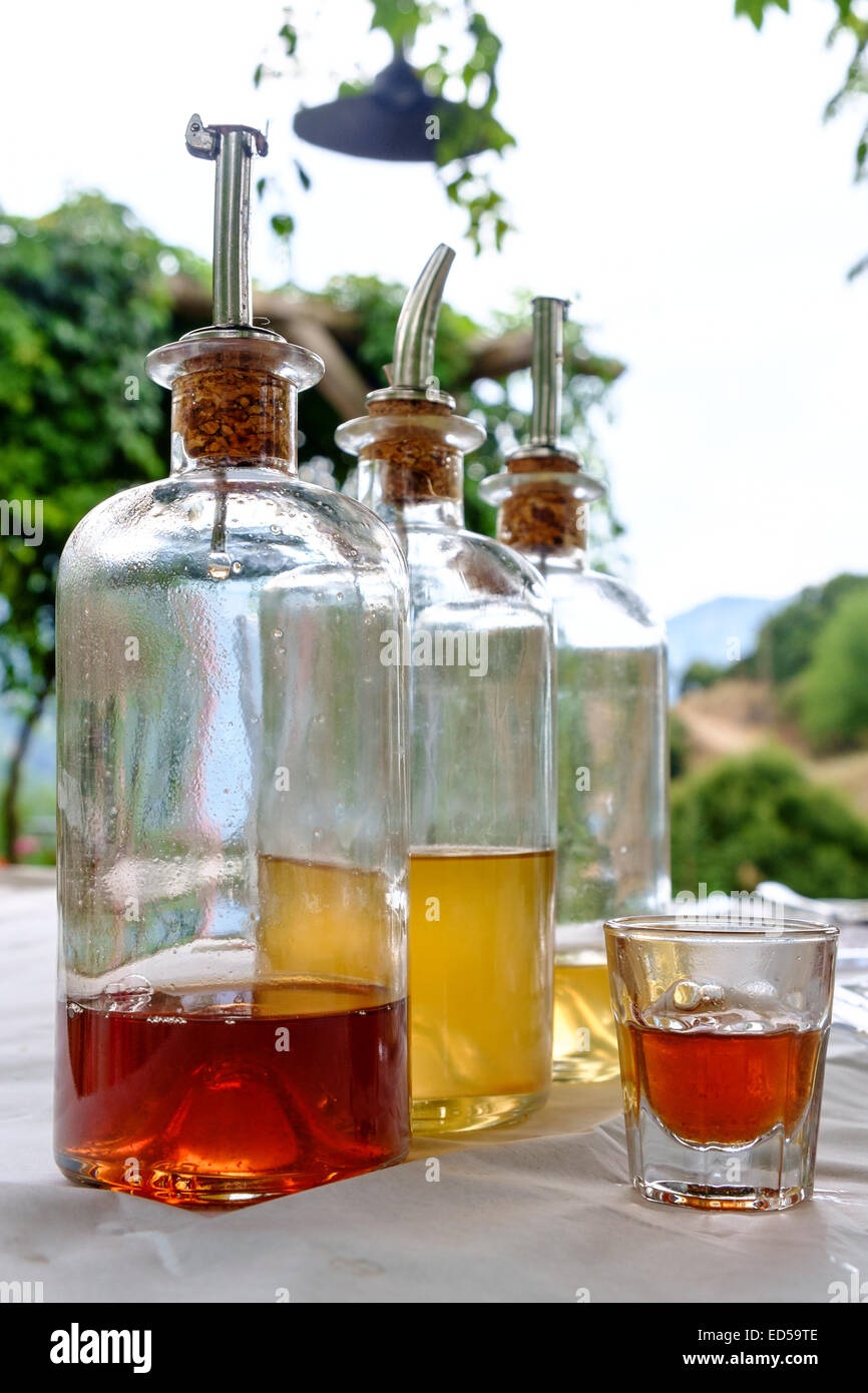 A selection of home made liqueurs photographed in a traditional tavern in Kastoria, Macedonia, Greece Stock Photo