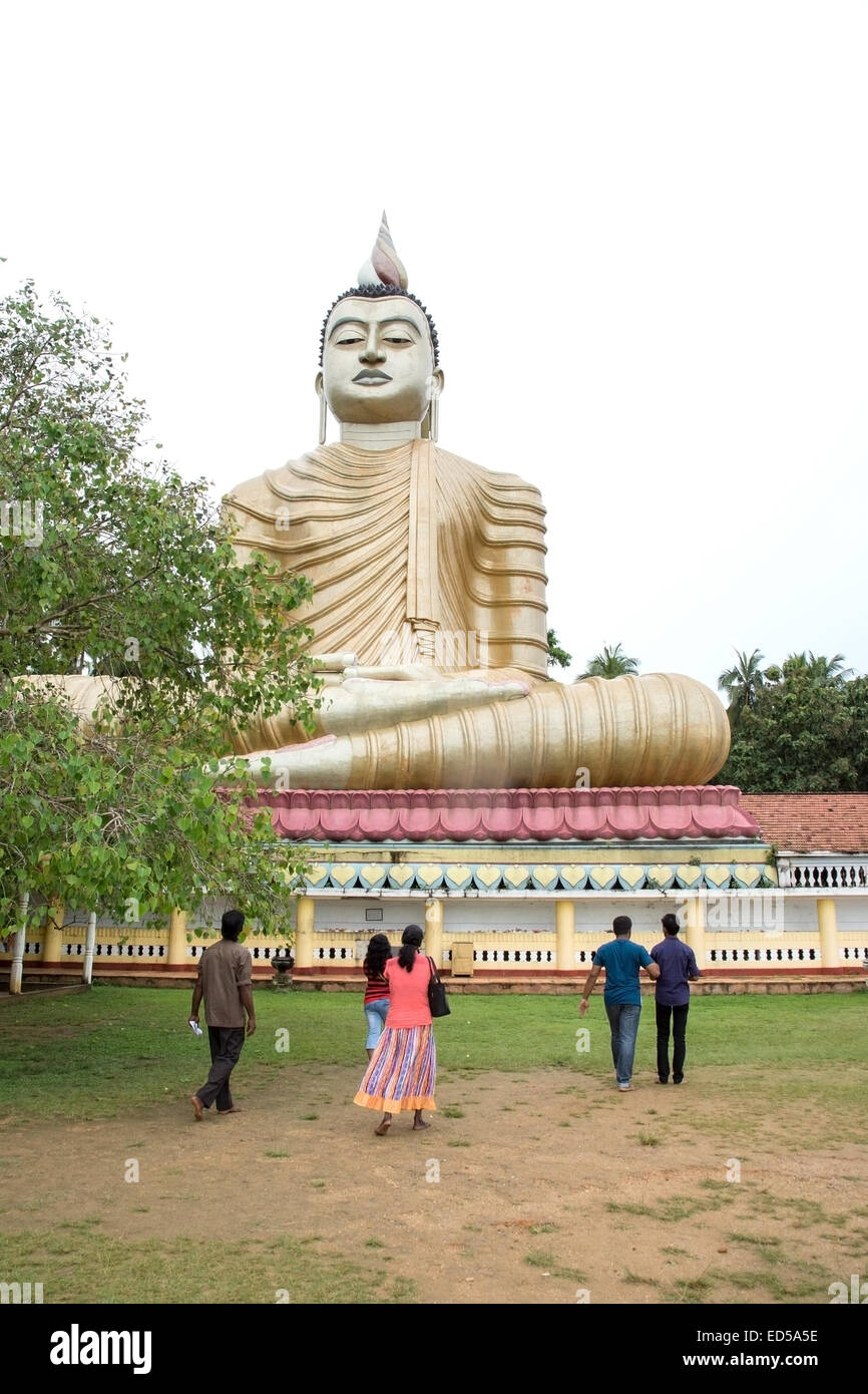 Sri Lanka's largest seated Buddha statue in Dickwella is 50 metres (160 ft) tall. Buddha and statues in buddhist monastery Wewur Stock Photo