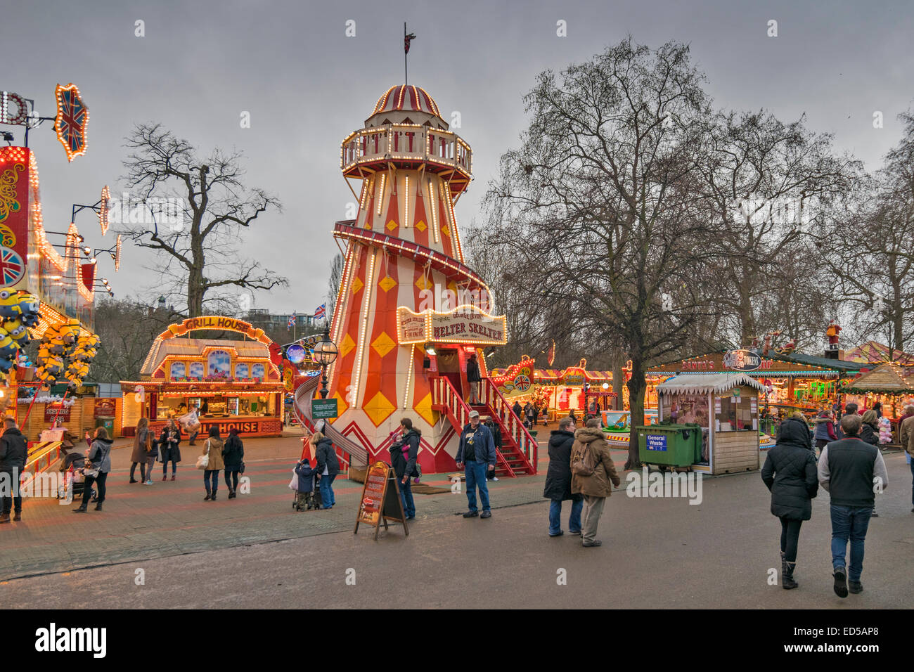 LONDON WINTER WONDERLAND IN HYDE PARK A LANE WITH HELTER SKELTER AND FOOD STALLS Stock Photo