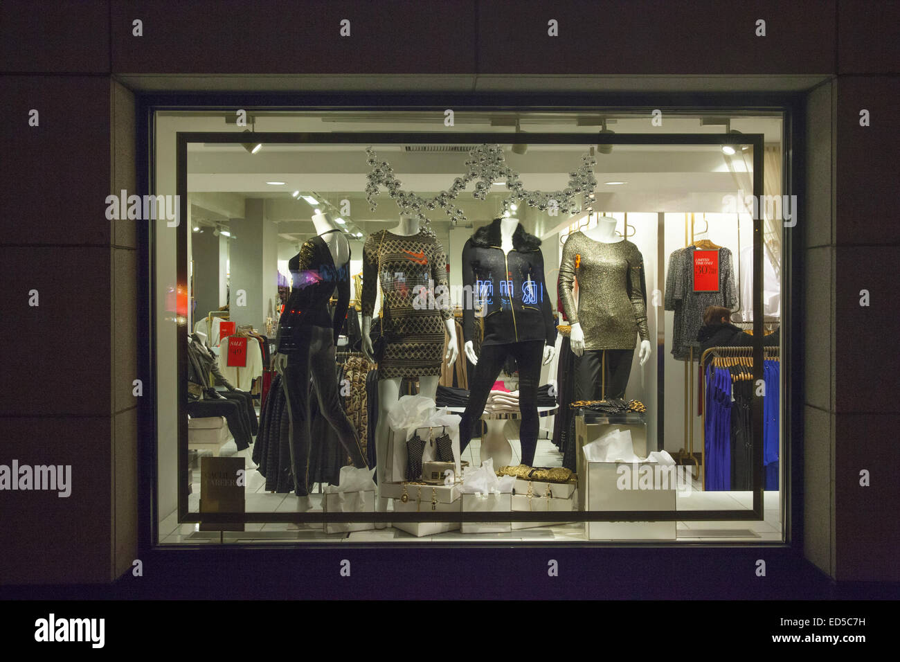 People walk past a window display at the luxury clothing store News  Photo - Getty Images