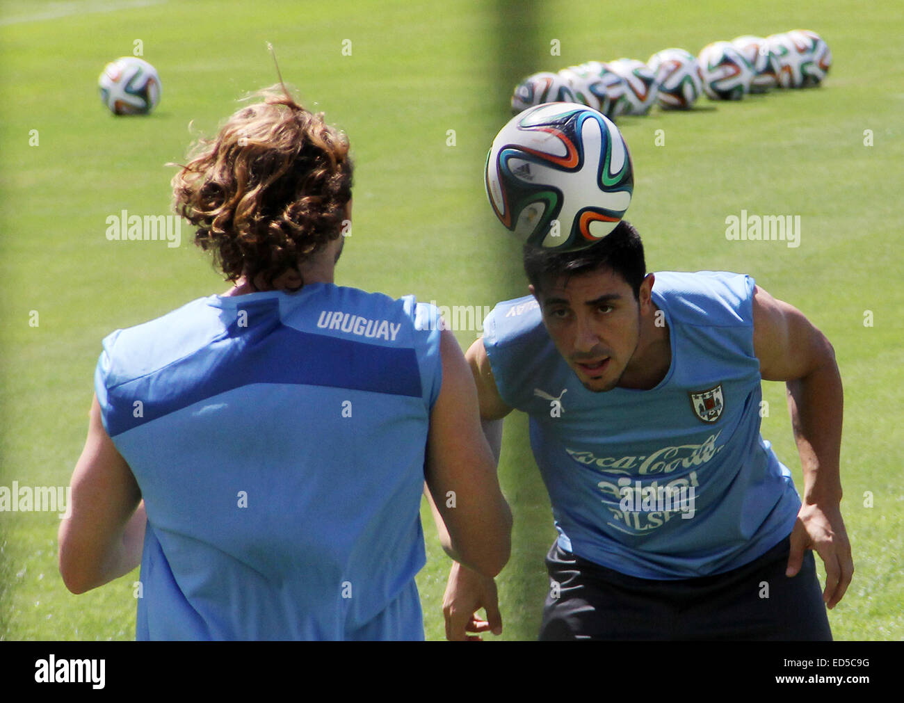 2014 FIFA World Cup - Uruguay national football team training held at Frasqueirao Stadium, following their win against Italy yesterday (24Jun14).  Featuring: Diego Forlan,Jorge Fucile Where: Natal, Brazil When: 25 Jun 2014 Stock Photo