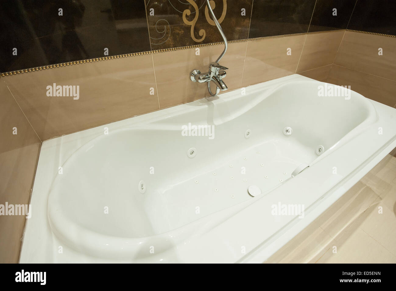 Luxury jacuzzi bath tub in bathroom of apartment Stock Photo