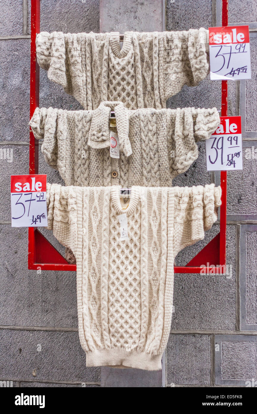 Aran knit jumpers on display outside a shop in Galway City Stock Photo