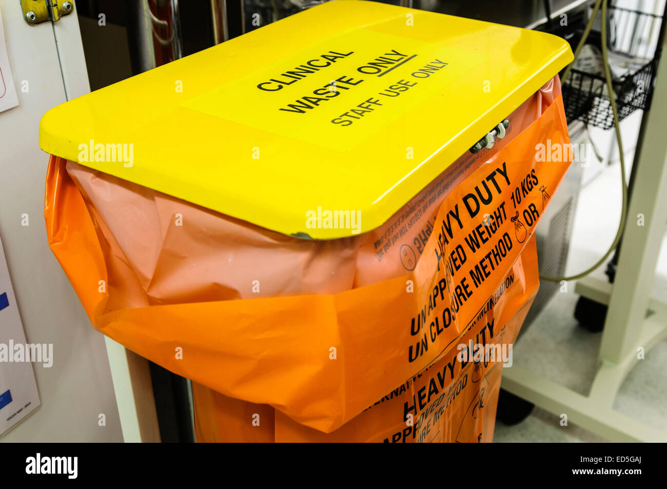 Clinical waste bin in a hospital clinical room. Stock Photo