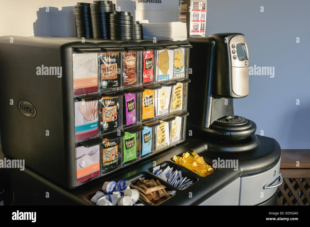 Flavia coffee machine with a selection of sachets of tea, coffee and hot chocolate. Stock Photo