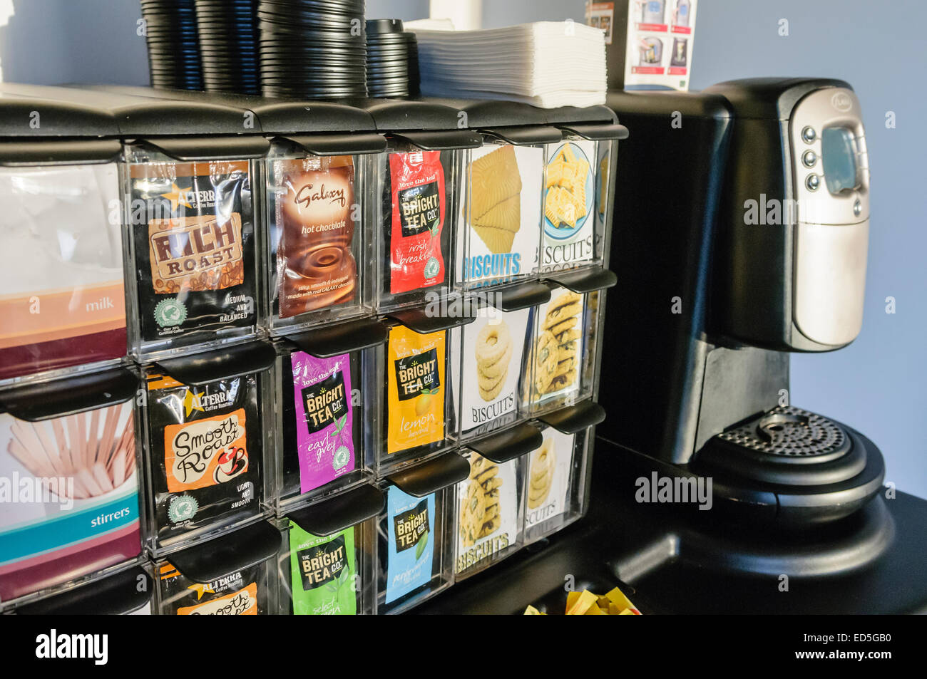 Flavia coffee machine with a selection of sachets of tea, coffee and hot chocolate. Stock Photo