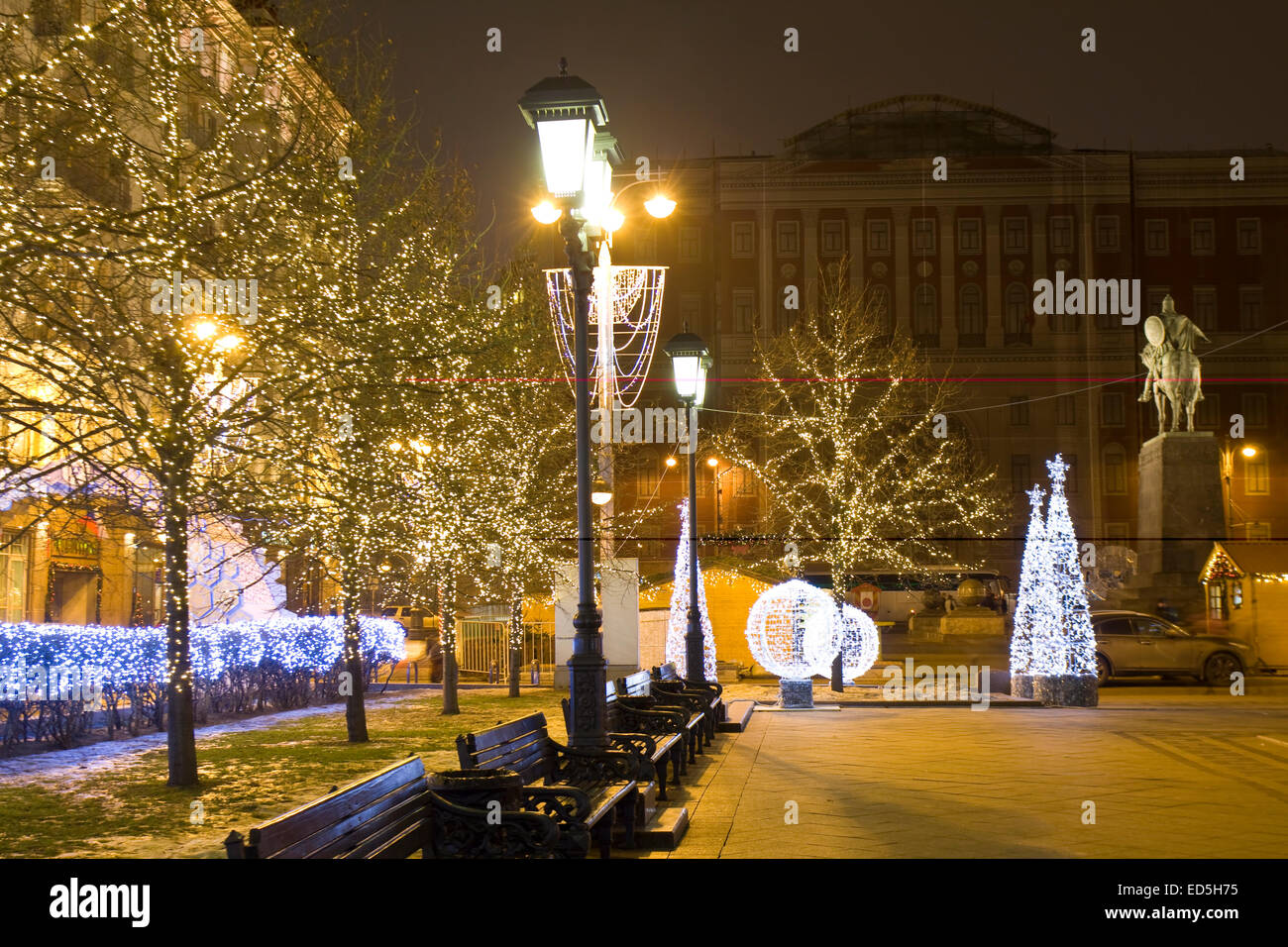 MOSCOW - DECEMBER 28, 2013: Tverskaya street illuminated for Christmas and New Year holidays, monument to king Yuriy Dolgorukiy Stock Photo