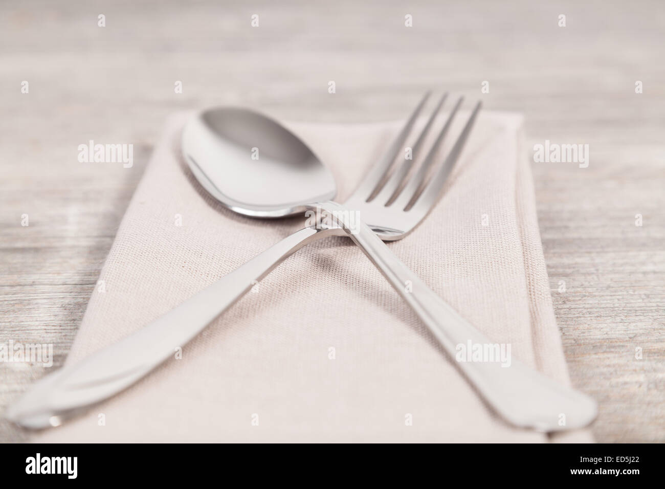 spoon and fork on a napkin Stock Photo Alamy