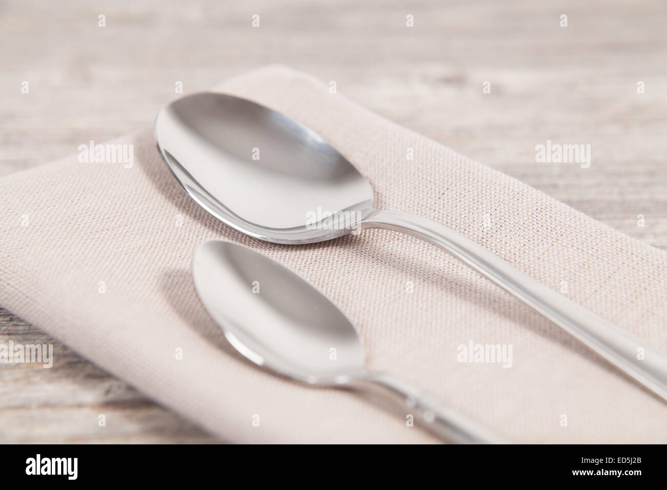 two spoons on a napkin Stock Photo