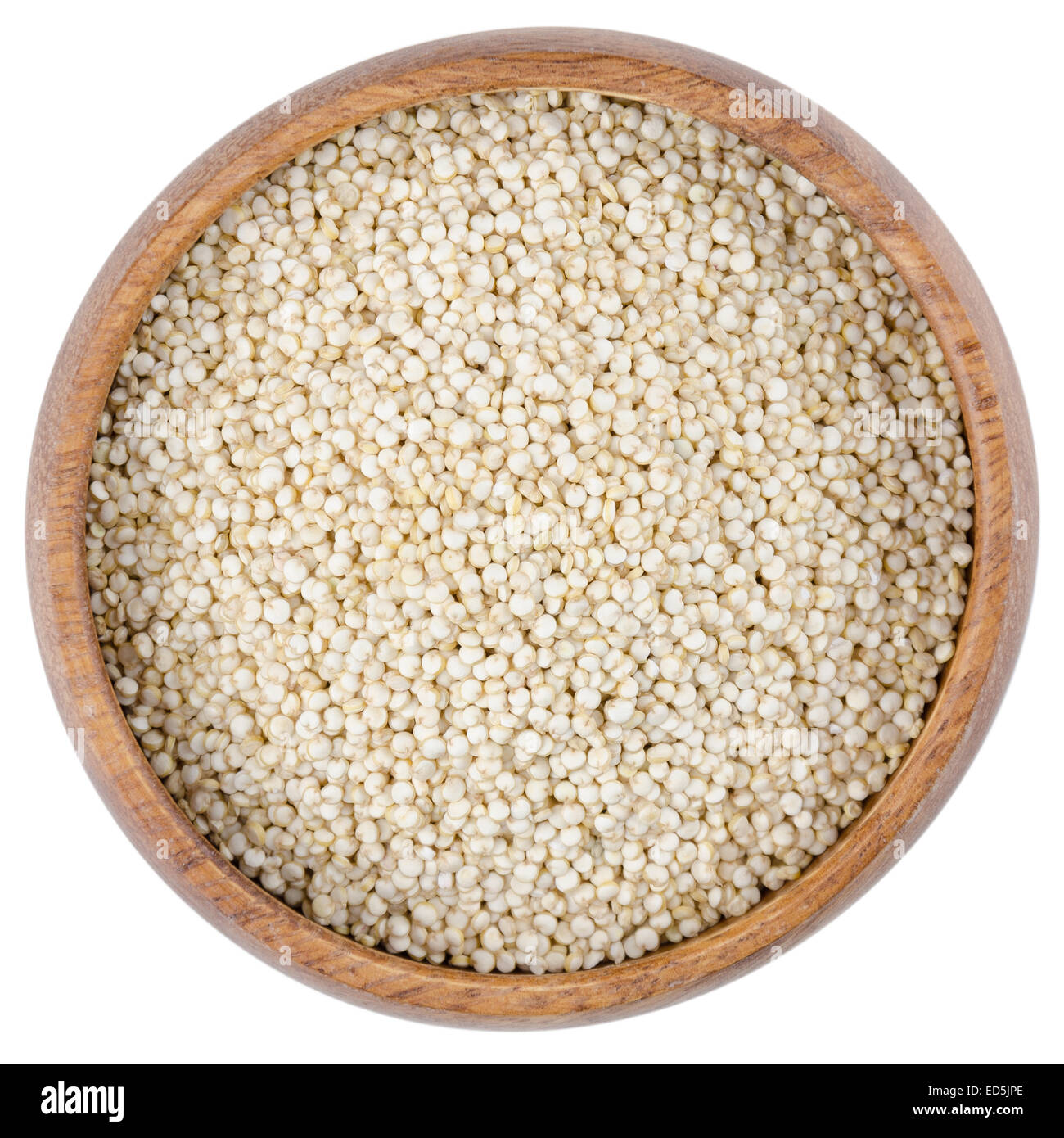 Quinoa Seeds in a Bowl. Raw quinoa seeds in a wooden bowl from above, isolated on white background. Stock Photo