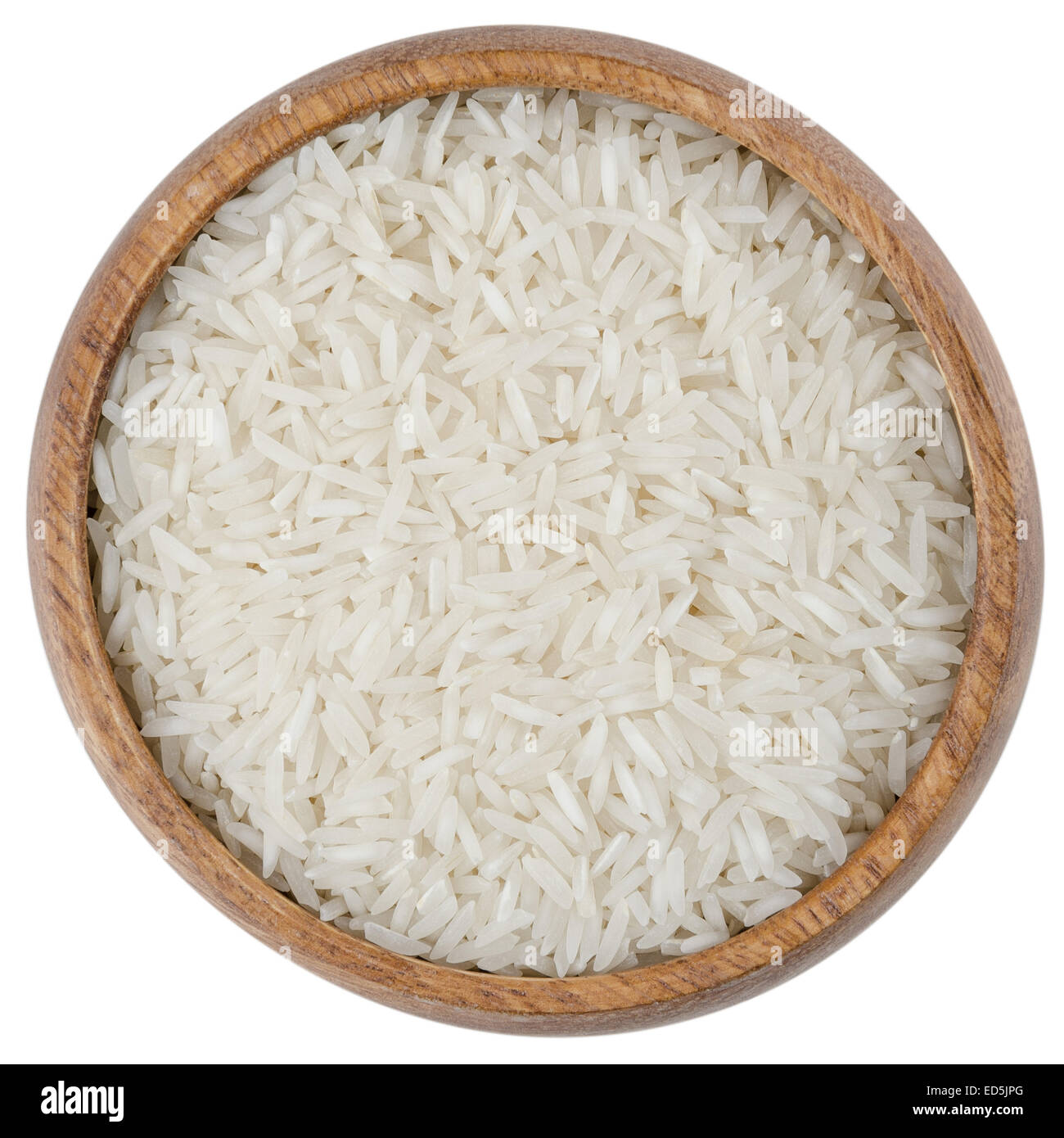 Basmati Rice in a Bowl. Processed Basmati rice in a wooden bowl from above, isolated on white background. Stock Photo